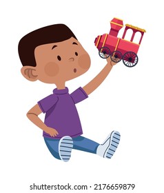 boy playing with train character