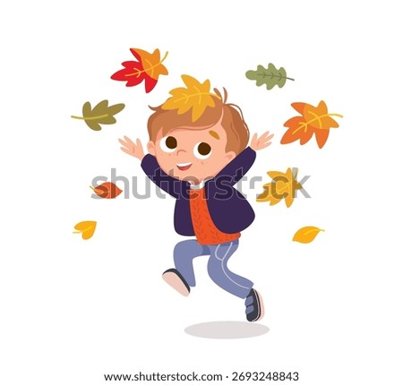 Boy plays with falling yellow and orange leaves, kid surrounded by yellow leaves. Autumn mood, arrival of fall.