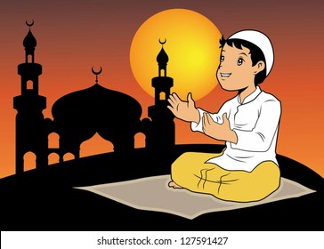 A boy praying with silhouette mosque background