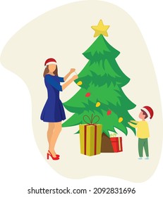 The boy is preparing for Christmas with his mother. Together they decorate the christmas tree. soft background
