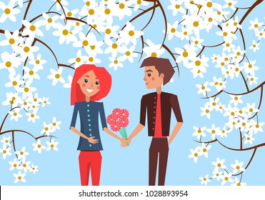 Boy presents bouquet of red gerberas to his redhead girlfriend on blue background surrounded with blooming branches vector illustration.