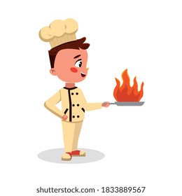 Boy Professional Chef Character Holding Pan with Fire Flame, Cute Kid in Uniform and Hat Cooking Tasty Dish Cartoon Style Vector Illustration