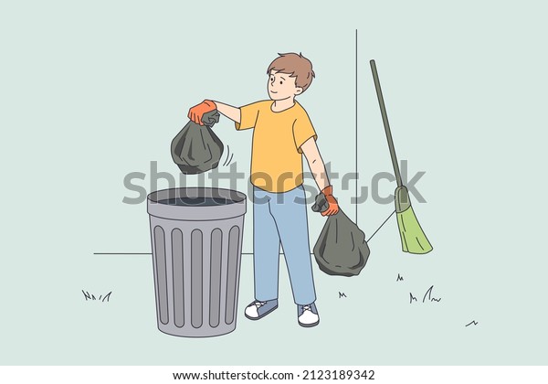 The boy puts things in order and throws bags of\
garbage into the trash can