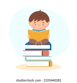 The boy reading a book - back to school and education concept	