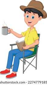 boy reading book and holding hot drink