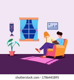 Boy Reading Book At Home
