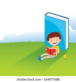 Boy reading book. A kid is enjoying his reading.
