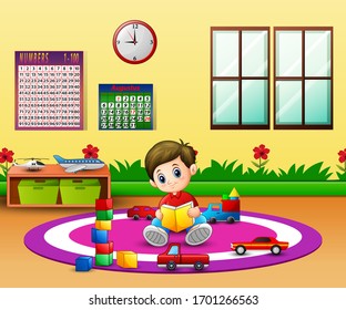 A boy reading a book on round carpet in kindergarten classroom