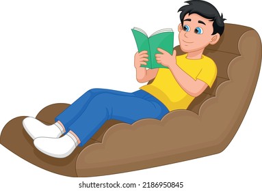 boy reading a book on the sofa