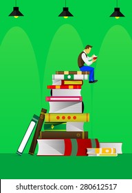 Boy reading a book at a top of a book heap