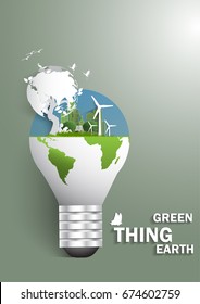 The boy reading a book under The Global bulb ,windmill and solar panels on the grass ,Environmentally friendly world. ecology,concept ,We to protect the environment and The earth