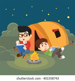 Boy reading book when Night camp