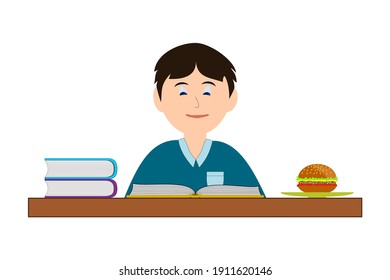 Der Junge liest und hat einen Hamburger auf dem Tisch