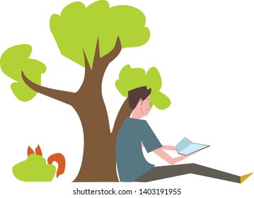 BOY READS A BOOK UNDER A TREE