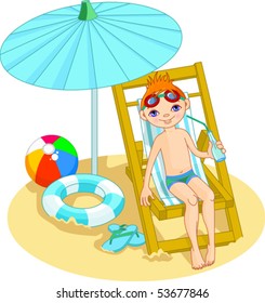 Boy relaxing on the sea beach deck-chair under umbrella
