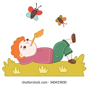 The boy resting on the grass. Children picture