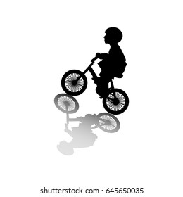A boy rides a bicycle 