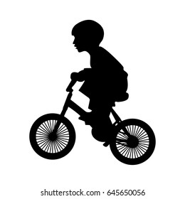 A boy rides a bicycle 