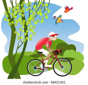 A boy rides a bicycle on a footpath through the fields