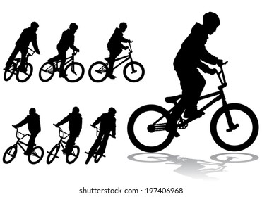 A boy rides a bicycle on a walk