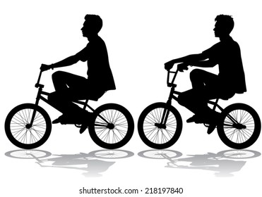 A boy rides a bicycle on a walk
