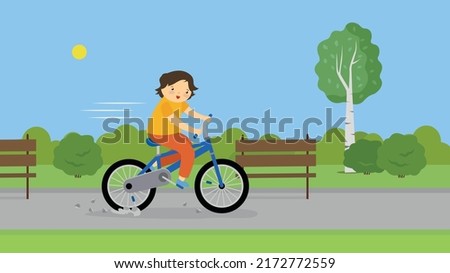 The boy rides a bicycle and ran into a stone