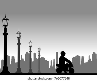 Boy rides on a motorcycle toy on the street, one in the series of similar images silhouette