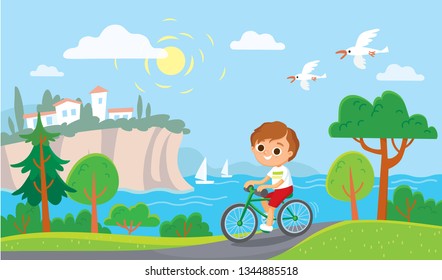 Boy riding a bicycle. Summer mediterranean background.