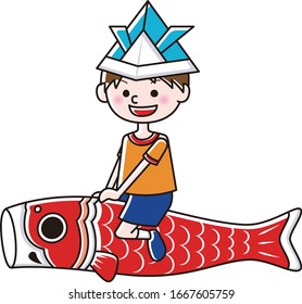 A boy riding a carp streamers.