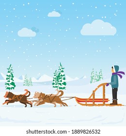 Boy riding dog sled on the snow