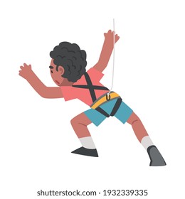 Boy Rock Climber Character, Cute Kid Climbing Wall On Ropes, Boy Doing Sports Or Having Fun In Adventure Park Cartoon Style Vector Illustration