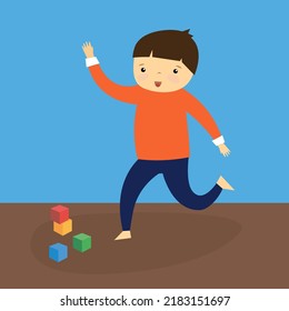 The boy runs on the scattered cubes