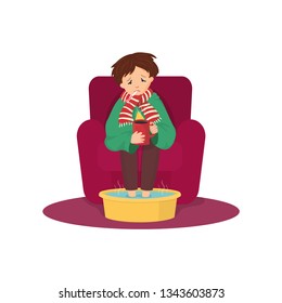 Boy in scarf having a cold, flu period, cup of tea, thermometer in his mouth