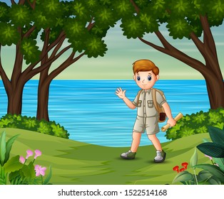 Boy scout with backpack hiking on the forest