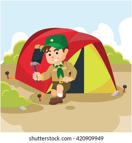 Boy scout preparing tent