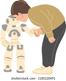 The boy shakes hands with the robot.