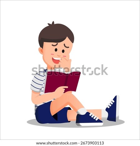 A boy sits on the floor reading a book with a shy smile and blushing cheeks, reacting to the book’s content