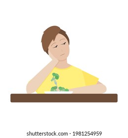 The boy sits thoughtfully with a plate of broccoli. 
