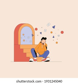 a boy sitting down feeling bored
