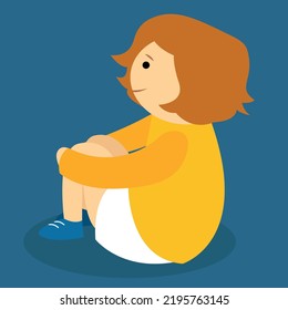 boy sitting with his hands on his knees