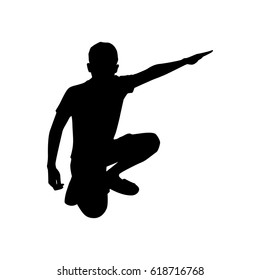 Boy sitting and pointing finger
