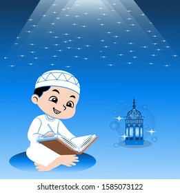 Boy is sitting and reading al quran