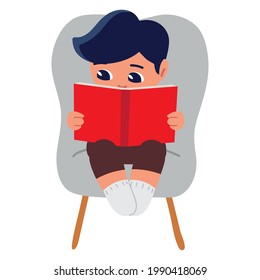 niño sentado leyendo un libro