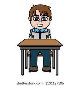 boy sitting school desk and reading a book