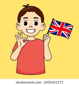 The boy smiles while holding the England flag and his other hand shows an OK gesture. Language learning concept