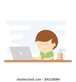 Boy smiling while using laptop for working