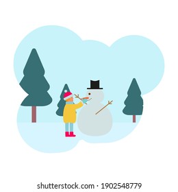 niño en la nieve haciendo un muñeco de nieve