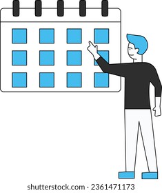 The boy is standing and pointing to the calendar.