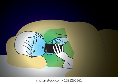 A boy staring at his smartphone in bed at night