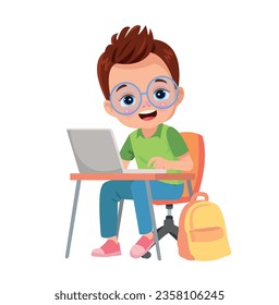 boy studying with computer at table